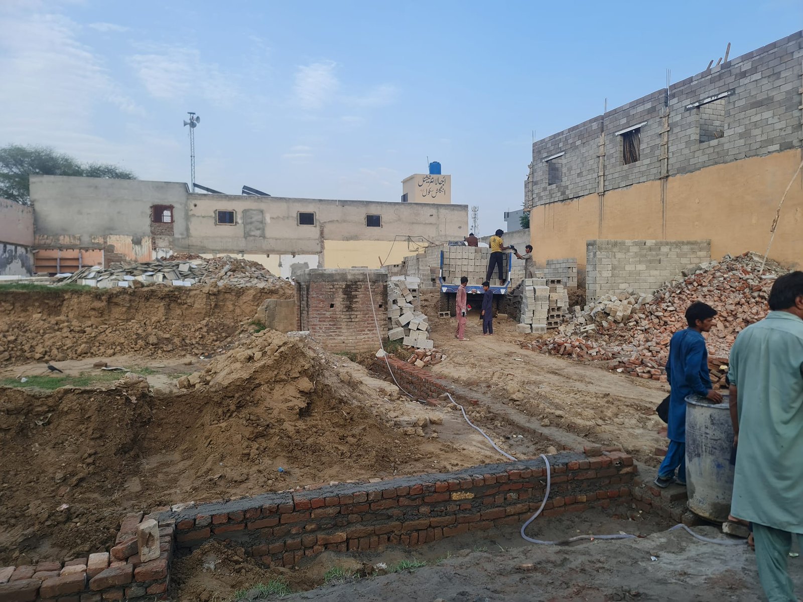 What Construction Materials Are Used for Building Homes Under the Apni Bahashat Housing Project?